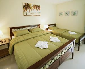 Voodi või voodid majutusasutuse Coco Cabana Apartelle toas