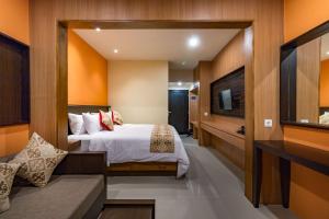 Postel nebo postele na pokoji v ubytování AB Hotel Kuta by AGATA + 19 fotografií
