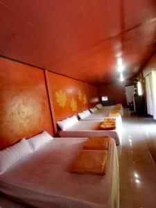 Postel nebo postele na pokoji v ubytování Ban Din Resort Chiang Rai
