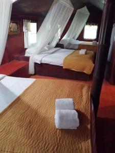 Postel nebo postele na pokoji v ubytování Ban Din Resort Chiang Rai