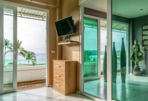 a living room with a view of the ocean at KATA PENTHOUSE SEA VIEW private POOL in Kata Beach