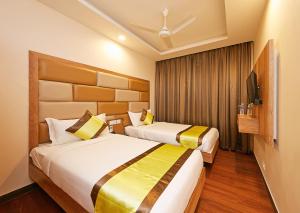 Ein Bett oder Betten in einem Zimmer der Unterkunft Taz Kamar Family Hotel