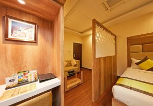 Ein Bett oder Betten in einem Zimmer der Unterkunft Taz Kamar Family Hotel