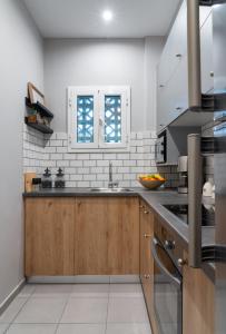 A kitchen or kitchenette at Absolute Athens X