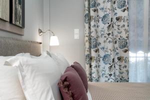 A bed or beds in a room at Absolute Athens X