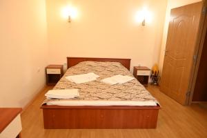 Postel nebo postele na pokoji v ubytování Harmony Hotel