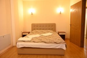 Postel nebo postele na pokoji v ubytování Harmony Hotel