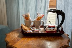 Příslušenství pro přípravu čaje a kávy v ubytování B&B La Casa Di Rosy + 14 fotografií