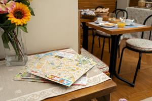 a table with a map on top of it at B&B La Casa Di Rosy in Rome