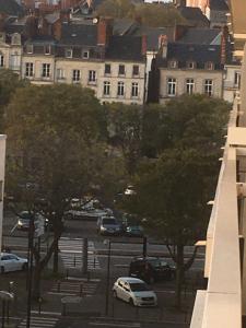 a white car parked in a parking lot with buildings at T2 hyper centre bord de Loire Parking in Nantes +3 photos