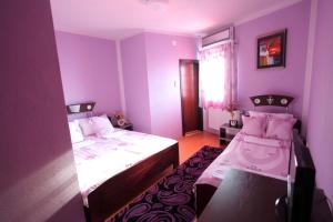 Postel nebo postele na pokoji v ubytování Villa Atina + 15 fotografií