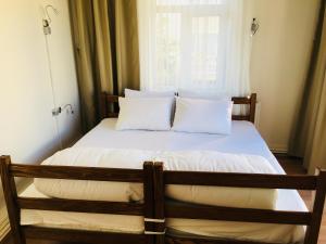 Postel nebo postele na pokoji v ubytování Kalkedon Hostel