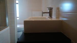 a bathroom with a sink and a toilet at 10 The Kiln in Westport