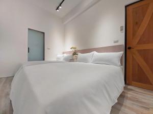 Letto o letti in una camera di Donggang Jingdi B&B