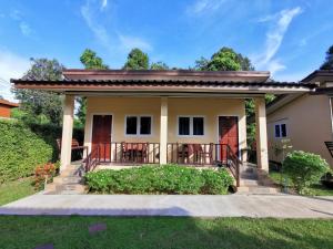 a house with a porch and a patio at SER-EN-DIP-I-TY - SHA Extra Plus in Ko Lanta