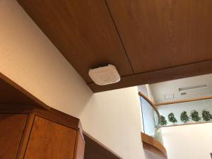 a kitchen with a ceiling with a box on it at Resort Project Myoko Kogen in Myoko