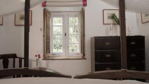 Postel nebo postele na pokoji v ubytování Le Colonial 1506 - Exclusive Luxury Hideaway