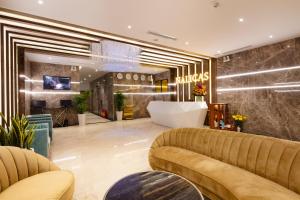 a lobby with a couch and a tub at Nalicas Nha Trang Hotel in Nha Trang