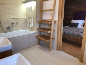 Posteľ alebo postele v izbe v ubytovaní The LODGE, Saalbach