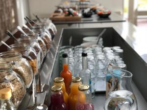 a bunch of glass bottles sitting in a sink at Hotel GSH in Rønne