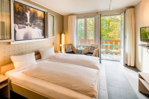 Katil atau katil-katil dalam bilik di Hotel Lindenhof by Crossworld AG