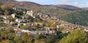 a small town on a hill with houses at PARNON HOTEL in Áyios Pétros