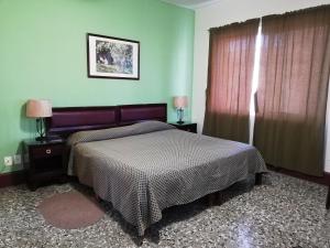 Llit o llits en una habitació de Hotel De Gante