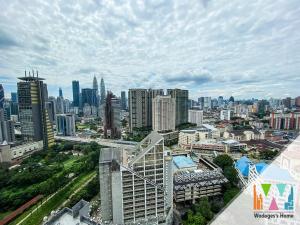 a view of a city skyline with tall buildings at KLCC Expressionz by WGS in Kuala Lumpur