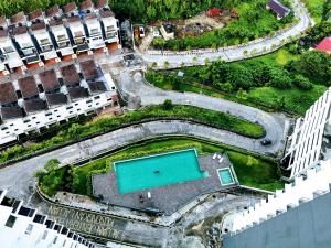 an aerial view of a building with a pool at Mr.J Homestay in Taiping