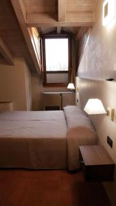 Postel nebo postele na pokoji v ubytování Hotel La Valle
