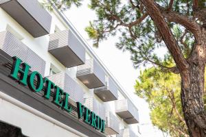 a building with a sign that reads houston hospital at Hotel Verdi in Lido di Jesolo