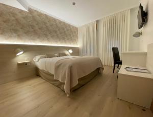 Postel nebo postele na pokoji v ubytování Hostal Paris
