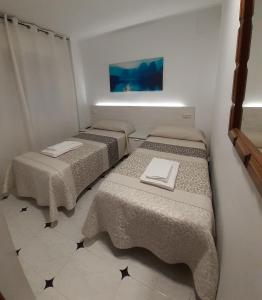 Posteľ alebo postele v izbe v ubytovaní Hostal Kokkola