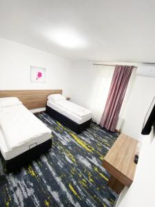 Letto o letti in una camera di Hotel Suljovic