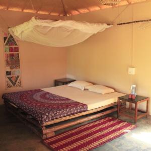 
A bed or beds in a room at Galaxy Jungle Huts
