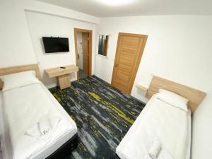 Letto o letti in una camera di Hotel Suljovic