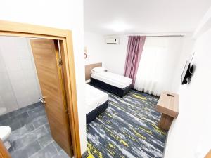 Letto o letti in una camera di Hotel Suljovic