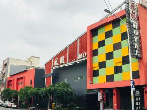 a colorful building on a city street with a building at 風緻主題精品旅館 in Dali