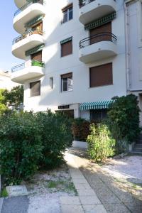 a building with balconies on the side of it at STUDIO PROMENADES DES ANGLAIS - CARRE&OR NICE in Nice