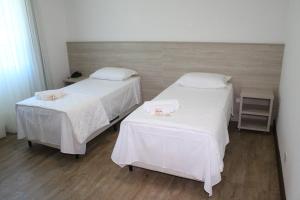 Postel nebo postele na pokoji v ubytování Serrano Hotel