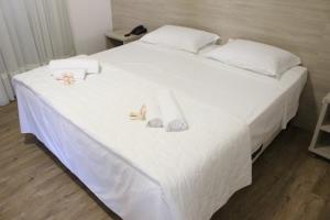 Postel nebo postele na pokoji v ubytování Serrano Hotel