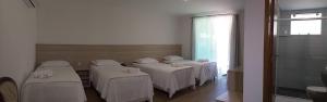 Postel nebo postele na pokoji v ubytování Serrano Hotel