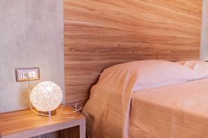 Кровать или кровати в номере Agriturismo al Riparo dai Venti