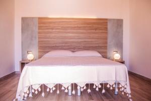 Кровать или кровати в номере Agriturismo al Riparo dai Venti