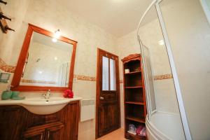 a bathroom with a sink and a shower at Kleo Cottages in Kalkan