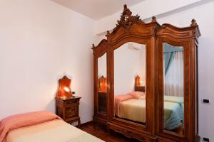 Säng eller sängar i ett rum på B&B Appia Felis