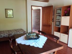 a room with a table and chairs and a bedroom at Badia il Vingone in Città di Castello