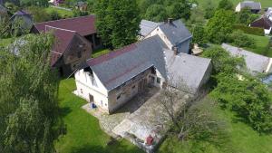 an aerial view of an old house in a field at Ubytování NAPOLI in Stará Červená Voda