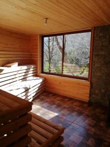 an empty room with a large window in a wooden cabin at Parque Amavida in Malalcahuello