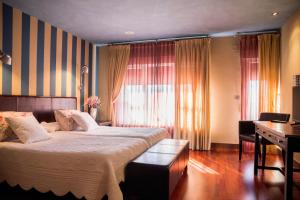 Postel nebo postele na pokoji v ubytování Hostal Fuentefria